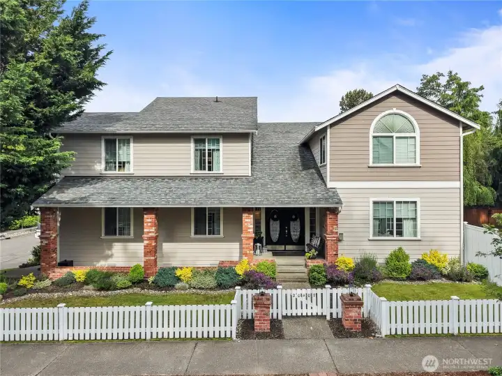 Impressive curb appeal with mature landscaping!
