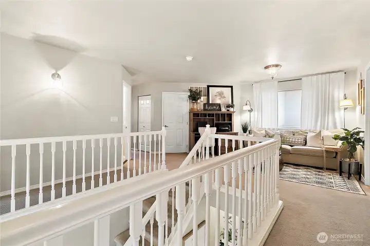 Generous loft overlooking upper level, offering additional living & gathering spaces.