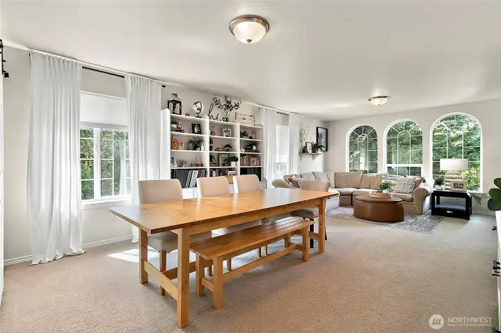 Oversized 5th bedroom currently serves as a bonus room, showcasing stunning arched windows and ample space for gatherings, relaxing or entertaining. Endless possibilities!