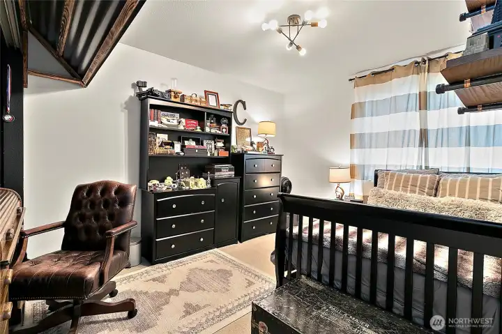 This bedroom features a built-in desk that can easily be converted back to a closet.