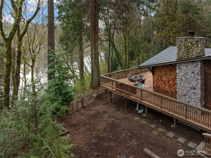 Deck set above the water with private, wooded surroundings