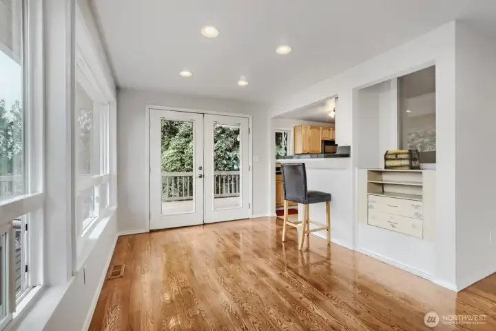 French doors lead from the main dining space to the spectacular deck.