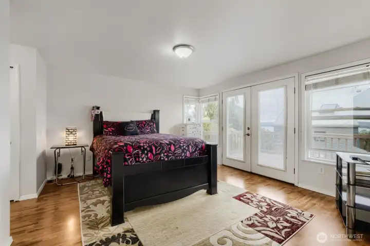 Primary bedroom with french door access to the massive deck.