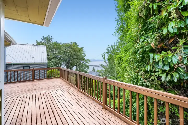 Wrap-around deck with a gate to the front yard.