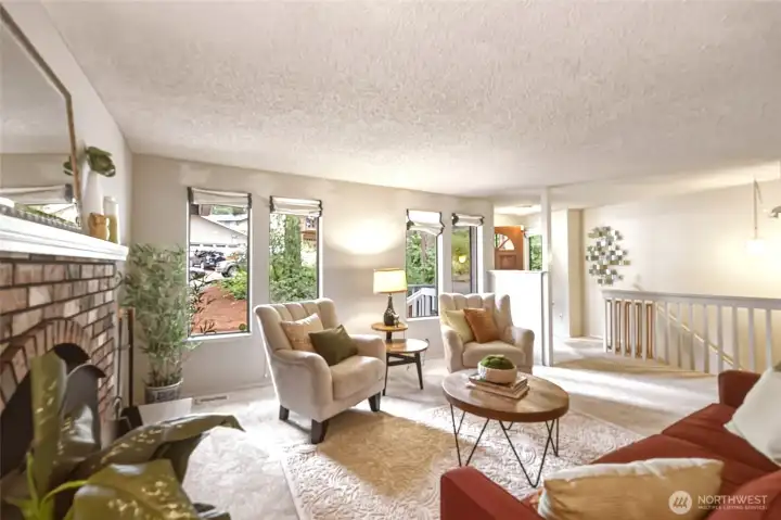 One thing I appreciate about homes from this era is that they weren't afraid of windows.Four portrait windows continue that wonderful mid-century vibe while inviting in beautiful natural light and peaceful views of the towering evergreens and native landscaping outside. Brand NEW bleached almond carpeting brightens the room, while the warm cream walls create a soft backdrop that's easy to make your own. The open staircase leads to the daylight basement, while the hallway beyond gently unfolds into the rest of the main floor. One thing I appreciate about homes from this era is that they weren't afraid of windows.Four portrait windows continue that wonderful mid-century vibe while inviting in beautiful natural light and peaceful views of the towering evergreens and native landscaping outside. Brand NEW bleached almond carpeting brightens the room, while the warm cream walls create a soft backdrop that's easy to make your own. The open staircase leads to the daylight basement, while the hallway beyond gently unfolds into the rest of the main floor.