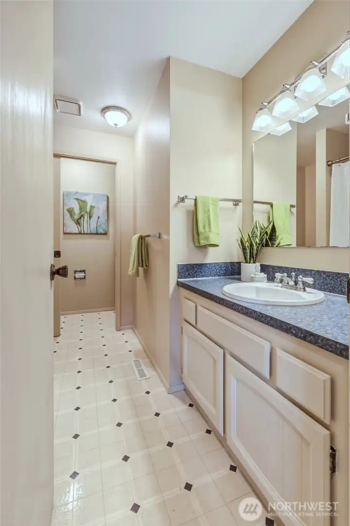 Conveniently located next to the flexible office, den or possible 4th BR, this full bathroom easily serves overnight guests while keeping the primary suite feeling more private. A generous vanity with cultured marble countertop offers great storage and prep space, while the full tub/shower combination is ready for everything from busy mornings to bubble baths for the little ones. It's another example of a home that was designed to work well for everyday life. Conveniently located next to the flexible office, den or possible 4th BR, this full bathroom easily serves overnight guests while keeping the primary suite feeling more private. A generous vanity with cultured marble countertop offers great storage and prep space, while the full tub/shower combination is ready for everything from busy mornings to bubble baths for the little ones. It's another example of a home that was designed to work well for everyday life.