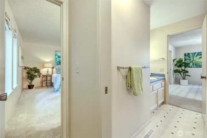 We love clever design! The primary suite enjoys its own private sink and vanity, plus direct access to this private toilet room and the full bathroom beyond. Close the pocket door and you've created a private ensuite experience. Leave it open and the full bathroom easily serves guests or the nearby office, den or possible 4th BR. It's one of those floor plans that solves more problems than you expect. We love clever design! The primary suite enjoys its own private sink and vanity, plus direct access to this private toilet room and the full bathroom beyond. Close the pocket door and you've created a private ensuite experience. Leave it open and the full bathroom easily serves guests or the nearby office, den or possible 4th BR. It's one of those floor plans that solves more problems than you expect.