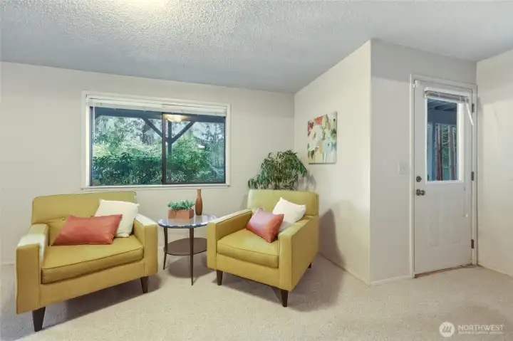 This inviting corner of the daylight basement has plenty of natural light and a beautiful backyard view, making it the perfect place for crafts, quilting, a home office, puzzles or your favorite comfy chair. The private exterior door lets you wander straight out to the patio and backyard, while mature landscaping fills the windows with greenery instead of neighboring houses. Open the windows and you'll quickly understand why the owners loved spending time here. Sometimes the soundtrack is birds, sometimes it's the breeze moving through the evergreens...either way, it's hard not to relax. This inviting corner of the daylight basement has plenty of natural light and a beautiful backyard view, making it the perfect place for crafts, quilting, a home office, puzzles or your favorite comfy chair. The private exterior door lets you wander straight out to the patio and backyard, while mature landscaping fills the windows with greenery instead of neighboring houses. Open the windows and you'll quickly understand why the owners loved spending time here. Sometimes the soundtrack is birds, sometimes it's the breeze moving through the evergreens...either way, it's hard not to relax.