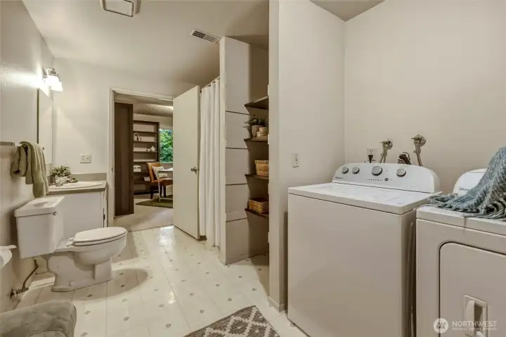 One thing you'll notice throughout this home is that storage was never an afterthought, and the laundry room is no exception. The included Whirlpool washer & dryer are joined by generous built-in shelving to help keep everything organized, while the spacious layout leaves plenty of room for additional cabinets, a folding station or extra storage solutions. Combined spaces with the full bathroom means cleaning up has never been easier. One thing you'll notice throughout this home is that storage was never an afterthought, and the laundry room is no exception. The included Whirlpool washer & dryer are joined by generous built-in shelving to help keep everything organized, while the spacious layout leaves plenty of room for additional cabinets, a folding station or extra storage solutions. Combined spaces with the full bathroom means cleaning up has never been easier.