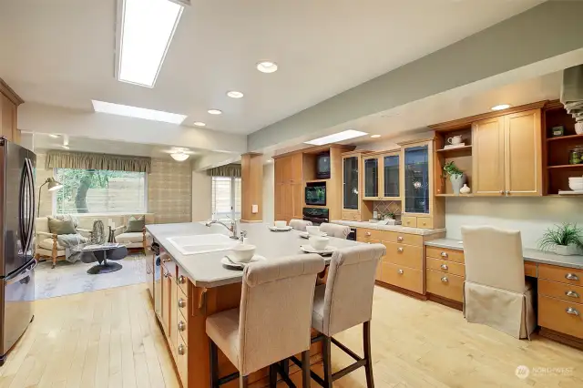 Remodeled kitchen with maple cabinets, under cabinet lighting.