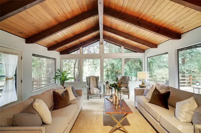 Vaulted ceilings in the living room with views to the trees.