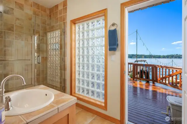 Lower level 3/4 bathroom with access to the deck, beach and dock.