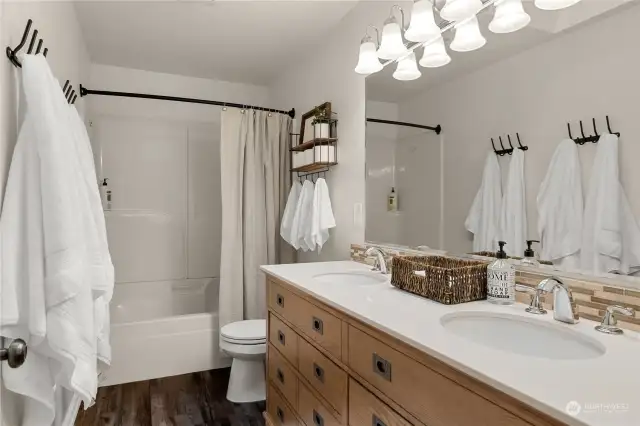 Full hall bathroom with double sink vanity