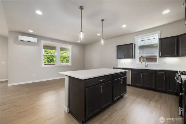 The spacious kitchen has an island and under cabinet lights as well.