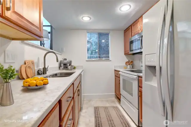 Galley kitchen w/ new flooring, countertops, faucet and undermount stainless sink