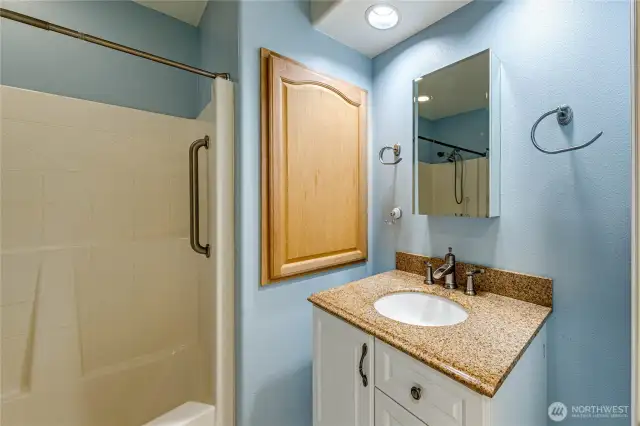Second full bath is off the hallway, and is adjacent to two bedrooms.