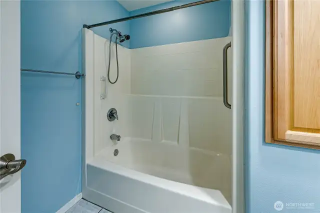 Roomy bathtub and shower in the second bathroom.