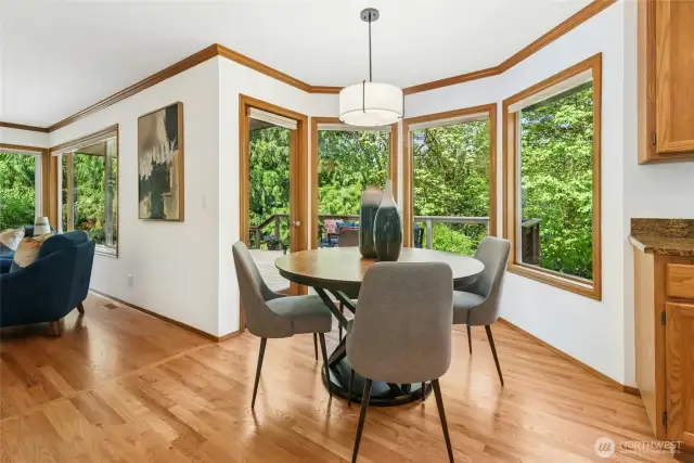 Informal, kitchen eating area with a French door leading out to the deck and backyard.