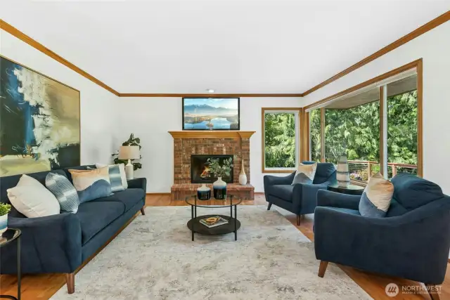 A Cozy family room becomes the focal point for gatherings. lots of widows allowing for more natural light.