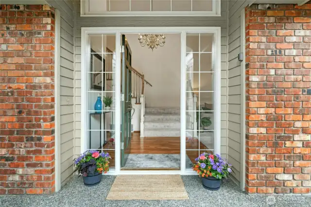 Enter this beautiful home with generously sized living areas, stunning refinished hardwood floors and brand new plush carpeting.  throughout.