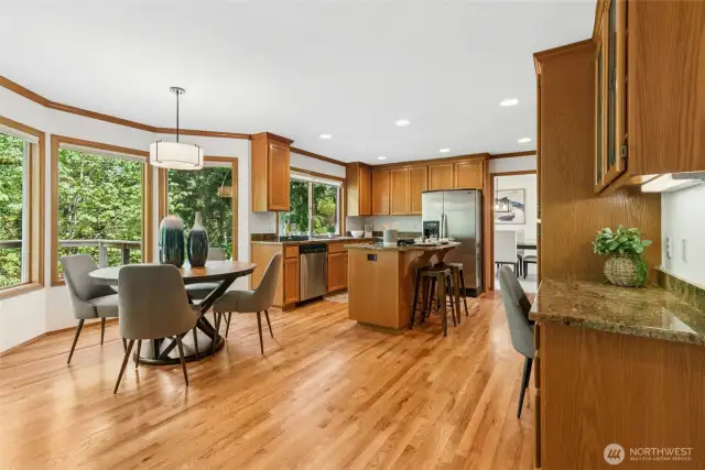 A delightful kitchen, boasting abundant cabinetry, sleek appliances and granite counter tops. Also included is a convenient, built-in kitchen planning desk.
