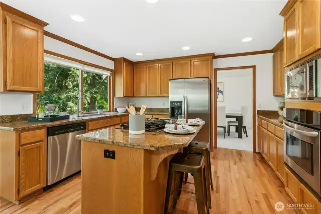 Breakfast bar offering additional kitchen seating. Note the quality stainless steel appliances.