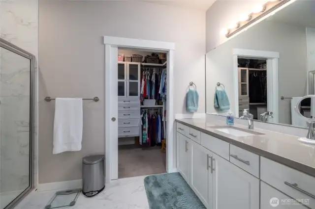 The primary bath has tile floor and a tile shower with lots of counter space!