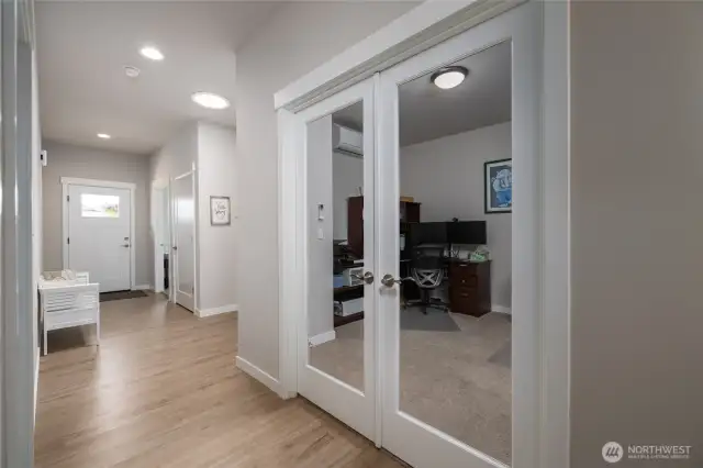 Luxury vinyl plank flooring is throughout the entry, kitchen, great room and dining room.