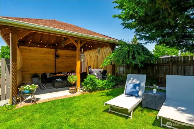 The covered gazebo is the perfect retreat and creates a perfect space for your morning cup of coffee or favorite beverage after work. Living here will feel like you are permanently on vacation!