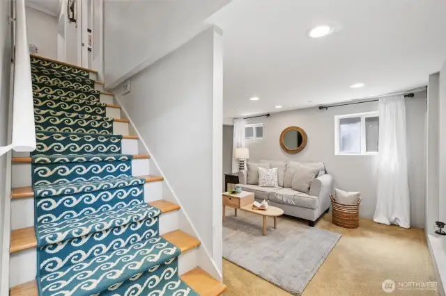 Down in the basement, you'll find a second living room, the third bedroom, laundry room and 3/4 bathroom.