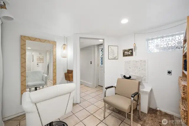 Downstairs in the basement, with the exterior door leading to the backyard.
