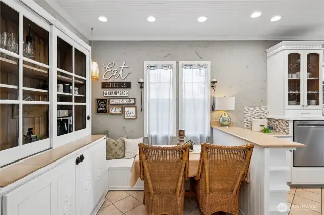 You'll love slow mornings in the breakfast nook, where the tile flooring and recessed lighting provide the perfect modern updates while maintaining the original charm of the home.