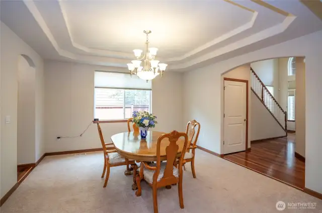 Gather in the formal dining room with its graceful coved ceiling and space for memorable dinner parties.