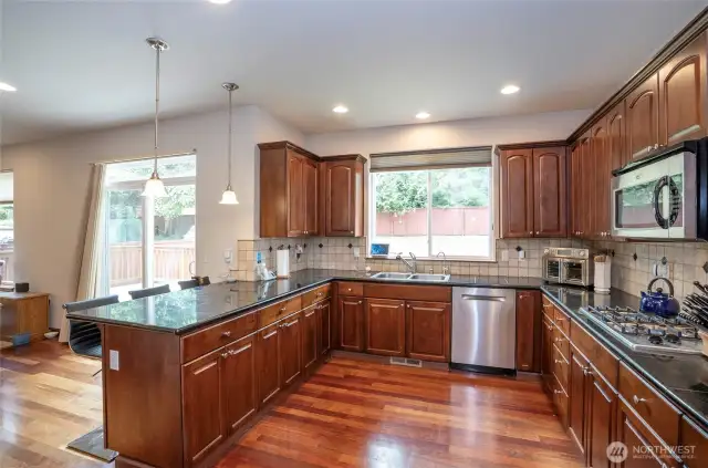 Experience the joy of cooking in a stunning kitchen that offers generous counter space and timeless style.