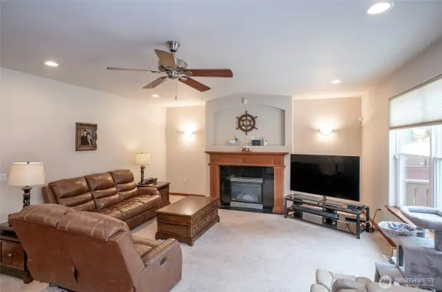 A gas fireplace brings warmth and comfort to the spacious family room, making it the perfect gathering place.