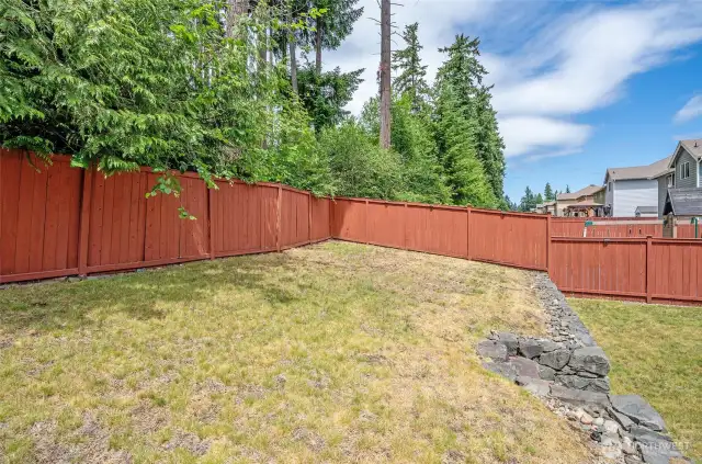 Elevated Section of the Backyard Offering Added Space and Possibilities.