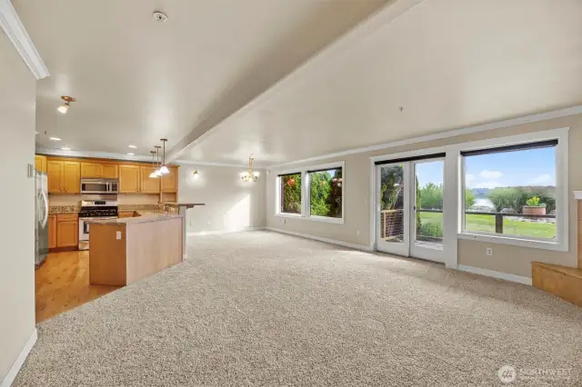 Windows are tinted to keep room comfortable and also have shades. Spacious, open living space.