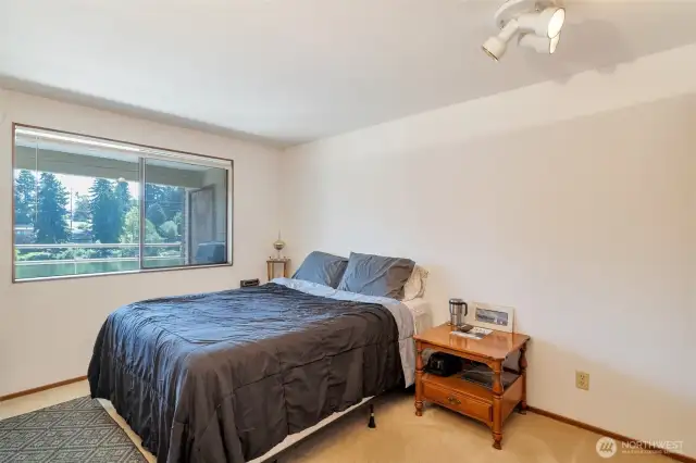 Bedroom one with lake view.