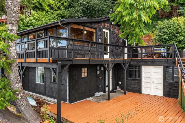 Multi-level deck gives you lots of useable outdoor space. Those white doors lead to a garden shed. Great place to store your tools and boating equipment.