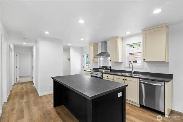 Hallway leads down to private office & 2 bedrooms