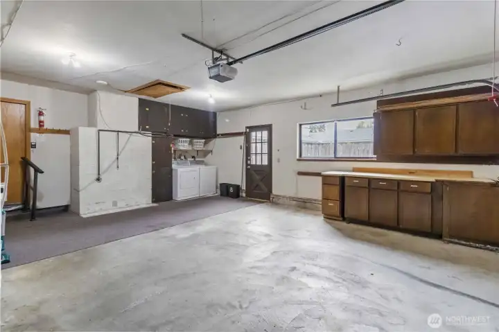 nice sized garage with storage and laundry