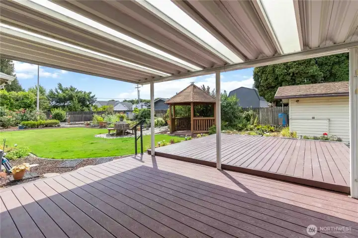 large covered patio area with trex decking