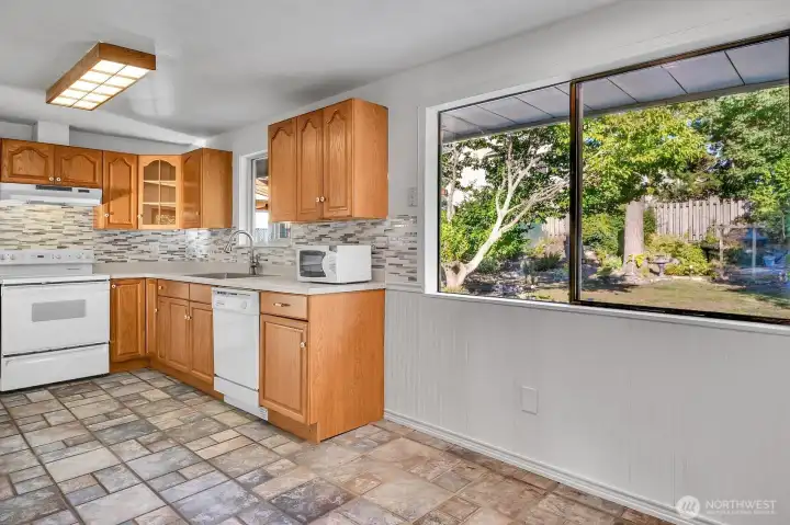 Large kitchen looks out onto the backyard.
