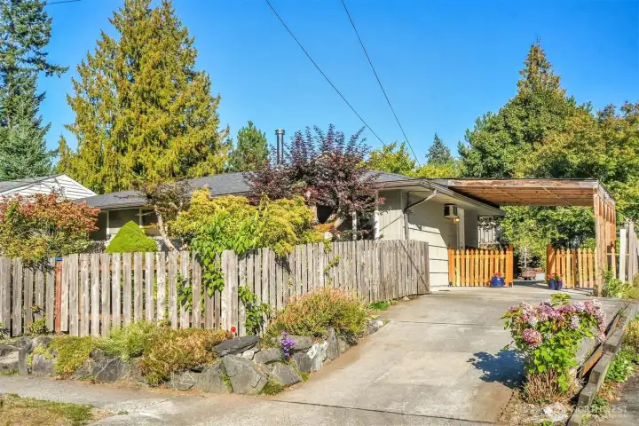Long driveway and carport.