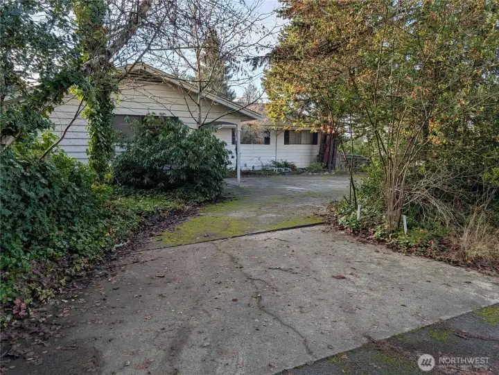 Drive thru driveway. Welcome to #11214 34th Ave E, Tacoma WA 98446. 3200+sf, 4+ br, 3 ba, 1.1 fenced acres.