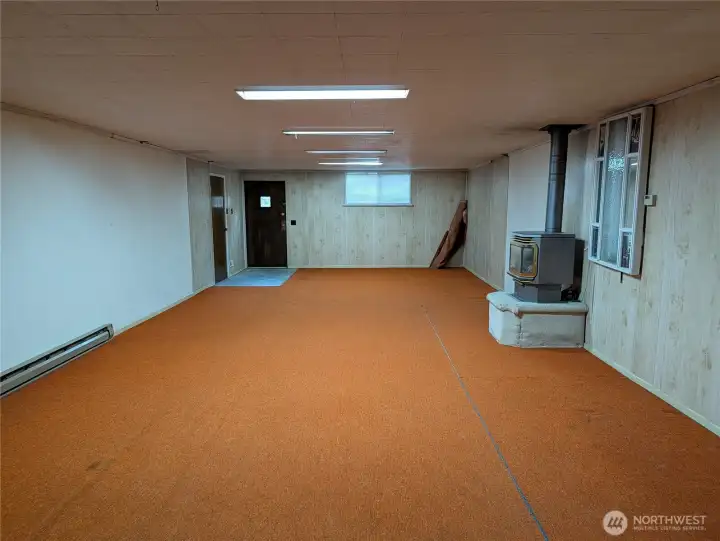 Huge 38'11" x 16'9" Rec room with gas fireplace. Welcome to #11214 34th Ave E, Tacoma WA 98446. 3200+sf, 4+ br, 3 ba, 1.1 fenced acres.