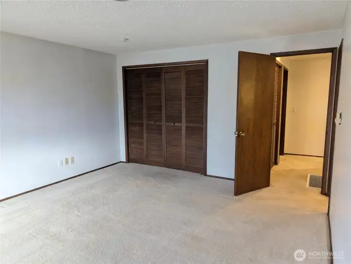 Prinmary bedroom. with walk in closet & primary bathroom. Welcome to #11214 34th Ave E, Tacoma WA 98446. 3200+sf, 4+ br, 3 ba, 1.1 fenced acres.