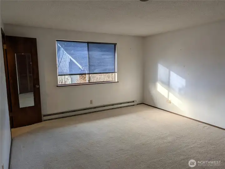 Prinmary bedroom. with walk in closet & primary bathroom. Welcome to #11214 34th Ave E, Tacoma WA 98446. 3200+sf, 4+ br, 3 ba, 1.1 fenced acres.