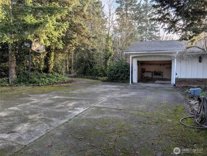 1 car attached garage. Drive thru driveway. Welcome to #11214 34th Ave E, Tacoma WA 98446. 3200+sf, 4+ br, 3 ba, 1.1 fenced acres.