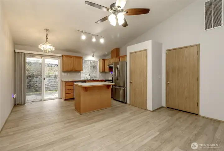 Kitchen with stainless appliances and new vinyl plank flooring